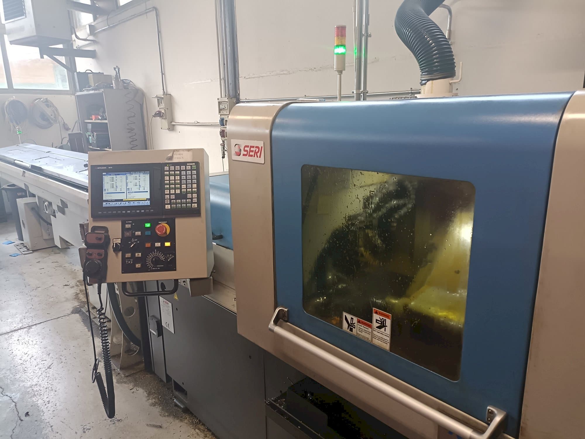 Vista Frontal  da NOMURA   máquina