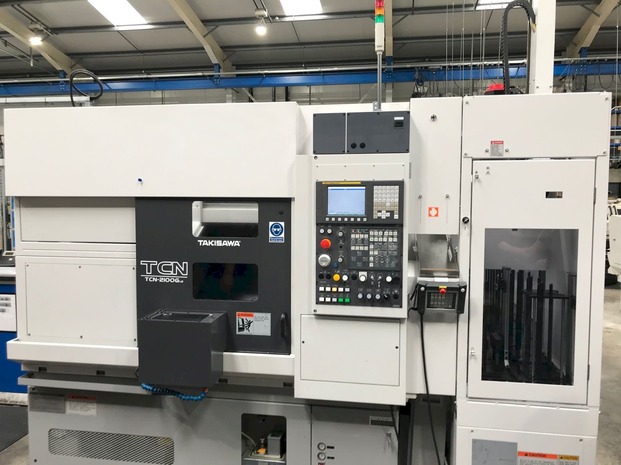 Vista Frontal  da Takisawa TCN-2100G L6  máquina