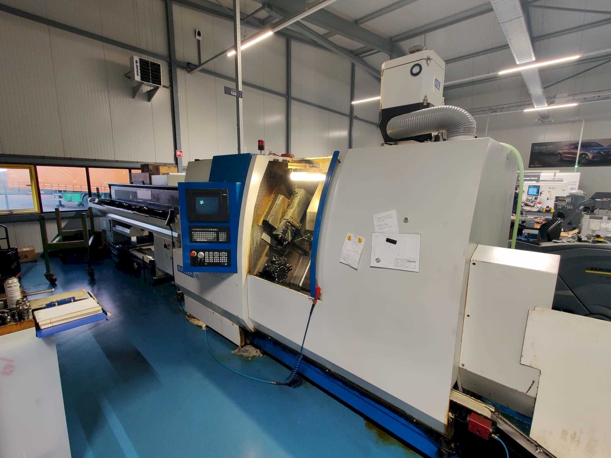 Vista Frontal  da Manurhin K'MX XL 32  máquina