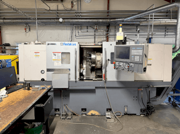 Vista Frontal  da Okuma Genos L300E-M with FMB Turbo 8-80  máquina